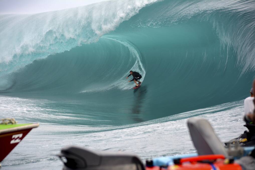 Dylan Longbottom rides a monster wave at Teahupo’o, Tahiti, during the filming of the new Point Break movie.