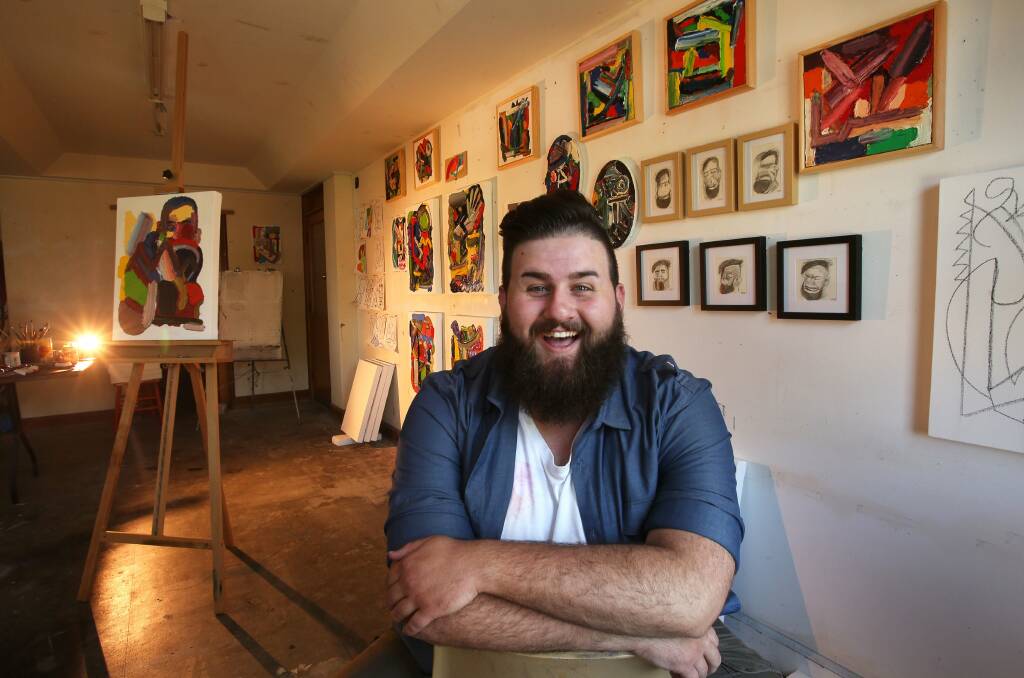 Wollongong Art Gallery's new resident artist, Nik Uzunovski, loves his studio. Picture: KIRK GILMOUR