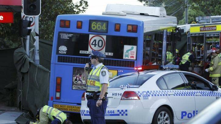 Rescue services at the scene in Neutral Bay where a cyclist was in a fatal collision with a bus. Photo: James Brickwood 