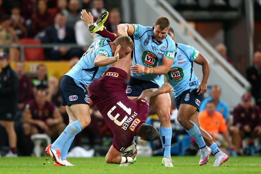 Trent Merrin (left) upends Corey Parker in the Origin III tackle which resulted in a four-match ban. Picture: GETTY IMAGES