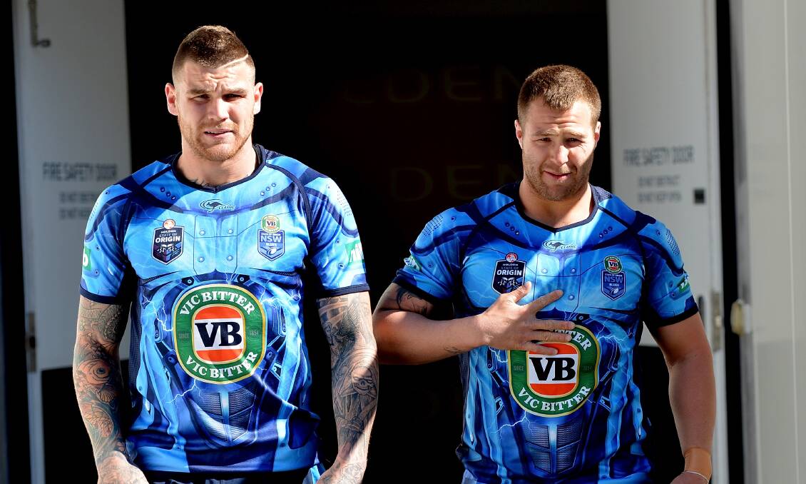 Josh Dugan and Trent Merrin enter the field for the Blues' captain's run at Suncorp Stadium on Tuesday. Picture: GETTY IMAGES