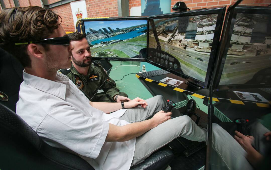 Test run: Wollongong High School student Sean Brannon tries a helicopter flight simulator on the first day of the Illawarra Coal Regional Careers Expo at the Unanderra hockey stadium. Picture: ADAM McLEAN