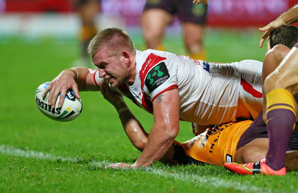 Dragons prop Mike Cooper drives over in his side's 12-10 win over the Broncos on Friday. Picture: GETTY IMAGES