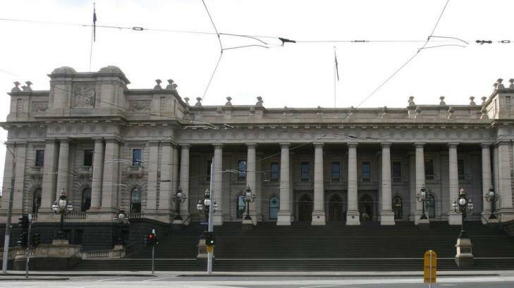 Politicians had rifle placement slits installed high on the front of the Victorian Parliament in the 1880s to shoot rioting voters. Photo: Andrew De La Rue