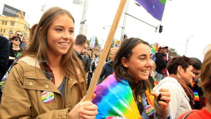 Jessica Feyder (left) and Samantha Ritchie lobby for marriage equality at a rally in Taylor Square, Darlinghurst, on Sunday. Photo: James Alcock