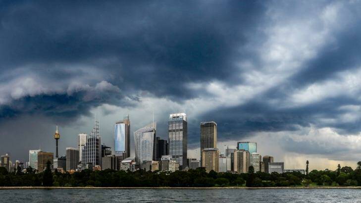 The storm front moves over the Sydney skyline. Photo: Dallas Kilponen