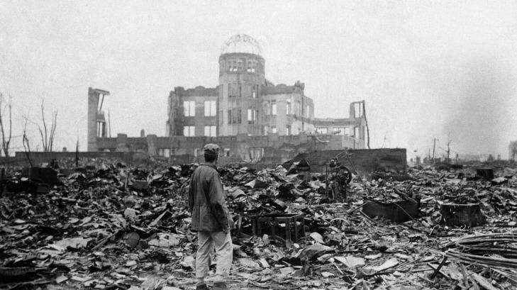 An Allied correspondent stands in the rubble of a building that once was a movie theatre in Hiroshima, on Sepember 8, 1945, two days after the first nuclear weapon ever used in warfare was dropped by the US. Photo: Stanley Troutman