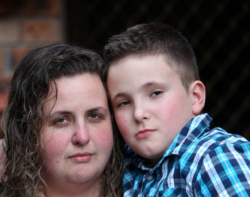 Zachary Matheson with mother Carlie. Zachary  had a pet cat that helped him with his autism. The cat, JR, has been missing  for two weeks. Picture: GREG TOTMAN