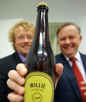 Anthony Albanese holding a bottle of the beer that was named after him.