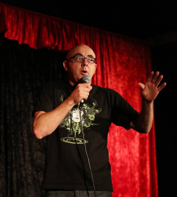 Local comedian Stu Macpherson on stage at the Wollongong Comedy Club in the basement of The Builders Club. Picture: GREG ELLIS