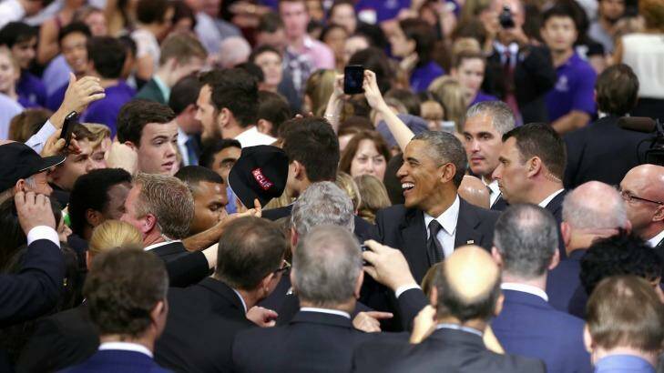 US President Barack Obama greets audience members after his speech at the University of Queensland. Photo: Alex Ellinghausen