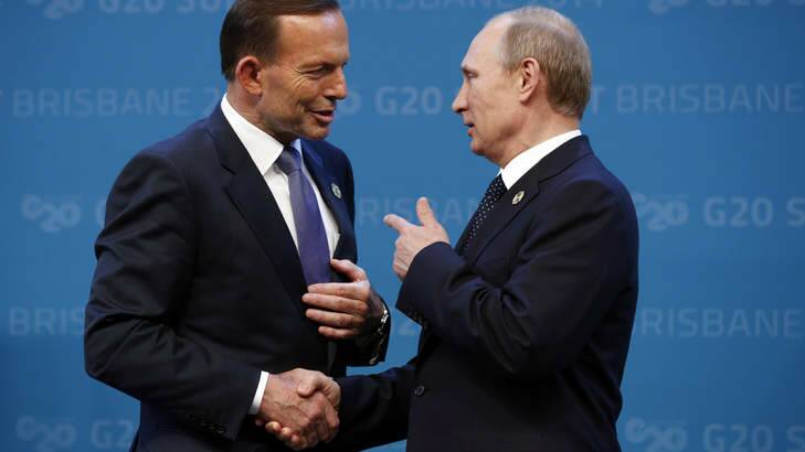 Prime Minister Tony Abbott greets Russian President Vladimir Putin at the G20 in Brisbane. Photo: Kevin Lamarque