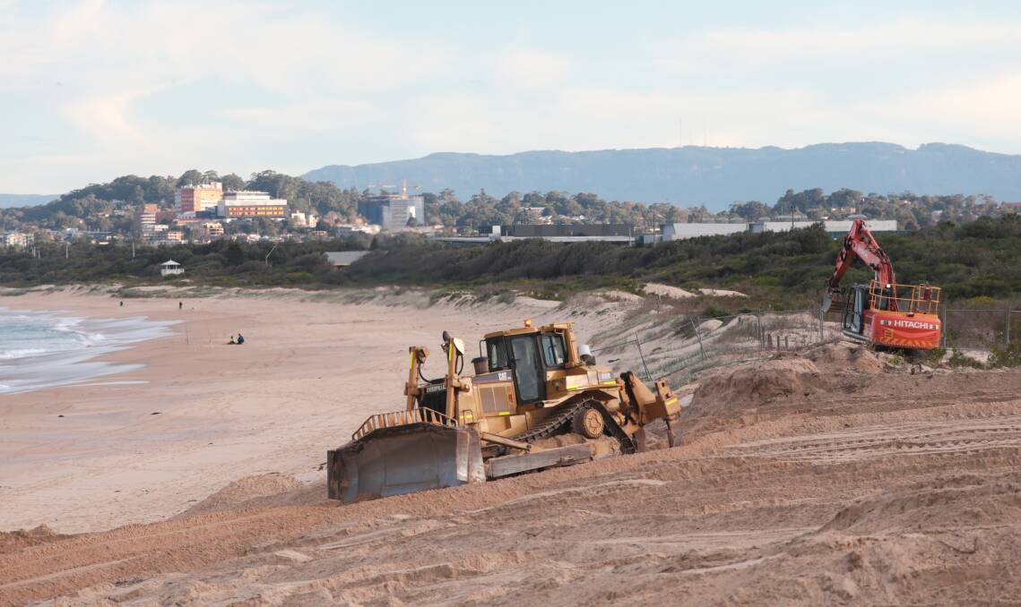 Smoothly does it: The dunes at Towradgi Beach are being flattened to improve sight lines.Picture: ADAM McLEAN
