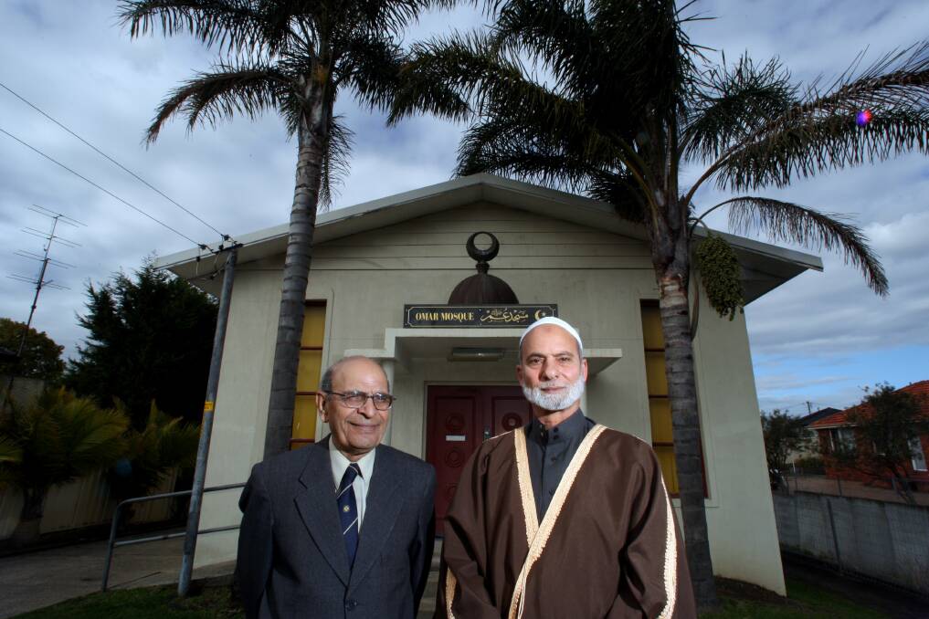 Peace lovers: Omar Mosque chairman Munir Hussain with mosque imam Sheikh Abdul Fattah. Dr Hussain says attitudes towards Muslims have changed recently.