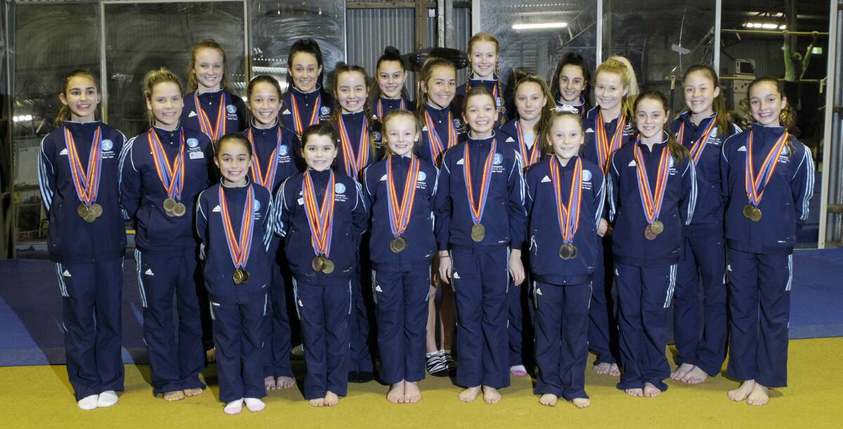 Stars: Oak Flats Albion Park Gymnastics and Acrobatics Club members who dominated for NSW at the National Championships. The club won seven gold medals plus two bronze in an outstanding achievement. Picture: ANDY ZAKELI