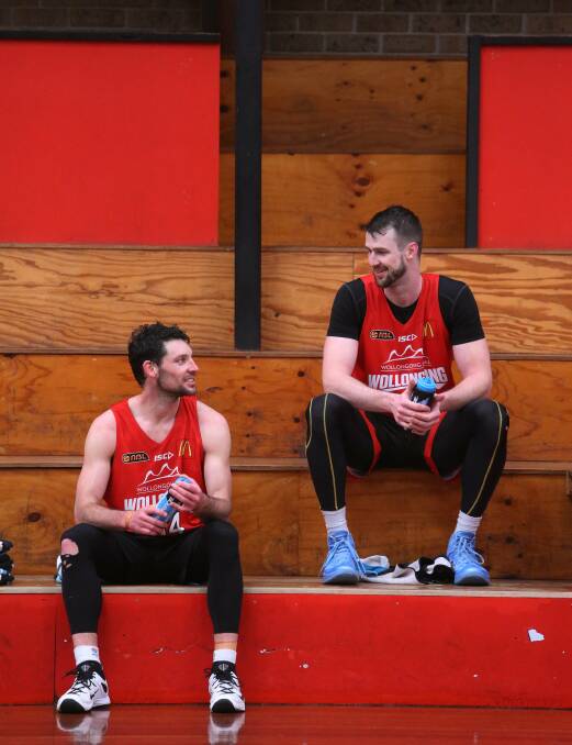 Kevin White and AJ Ogilvy have a quiet word at Hawks training on Wednesday.Picture: ROBERT PEET