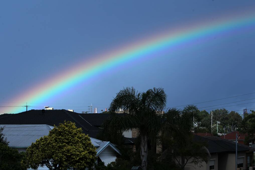 Colourful: A rainbow arches over Wollongong on Monday - a magical day of both sun and rain. Picture: GREG TOTMAN