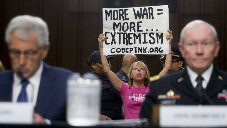 Now hear this: A demonstrator disrupts a Senate Armed Services Committee hearing in Washington. 
