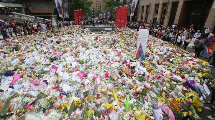 People queued up to lay their flowers at Martin Place.  Photo: Cole Bennetts