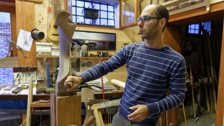 Pierro Dri handcrafts a forcola, or rowlock, for a gondola. Photo: Michael Gebicki