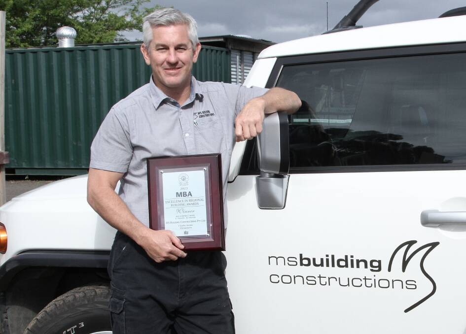 Martin Stewart displays MS Building Constructions' latest award.Picture: GREG ELLIS
