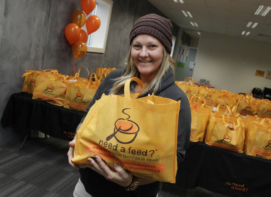Holly Arneman receives a parcel from Need a Feed at CareSouth Berkeley. Picture: ANDY ZAKELI