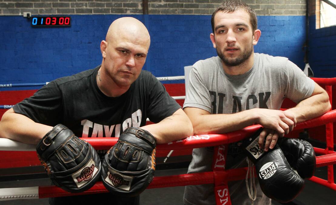 Steve Psaras, right, with Shannan Taylor who is training Psaras for a return to the ring. Picture: GREG TOTMAN