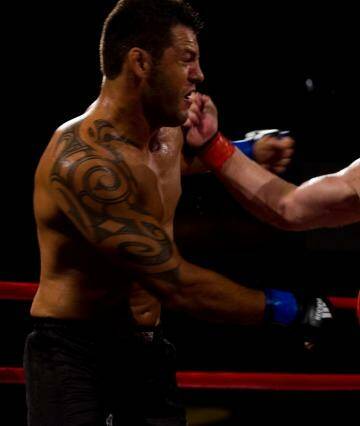 Switch in sports: Dan Kelly lands a right-hander on UFC opponent Fabio Galeb. Photo: Paul Jeffers