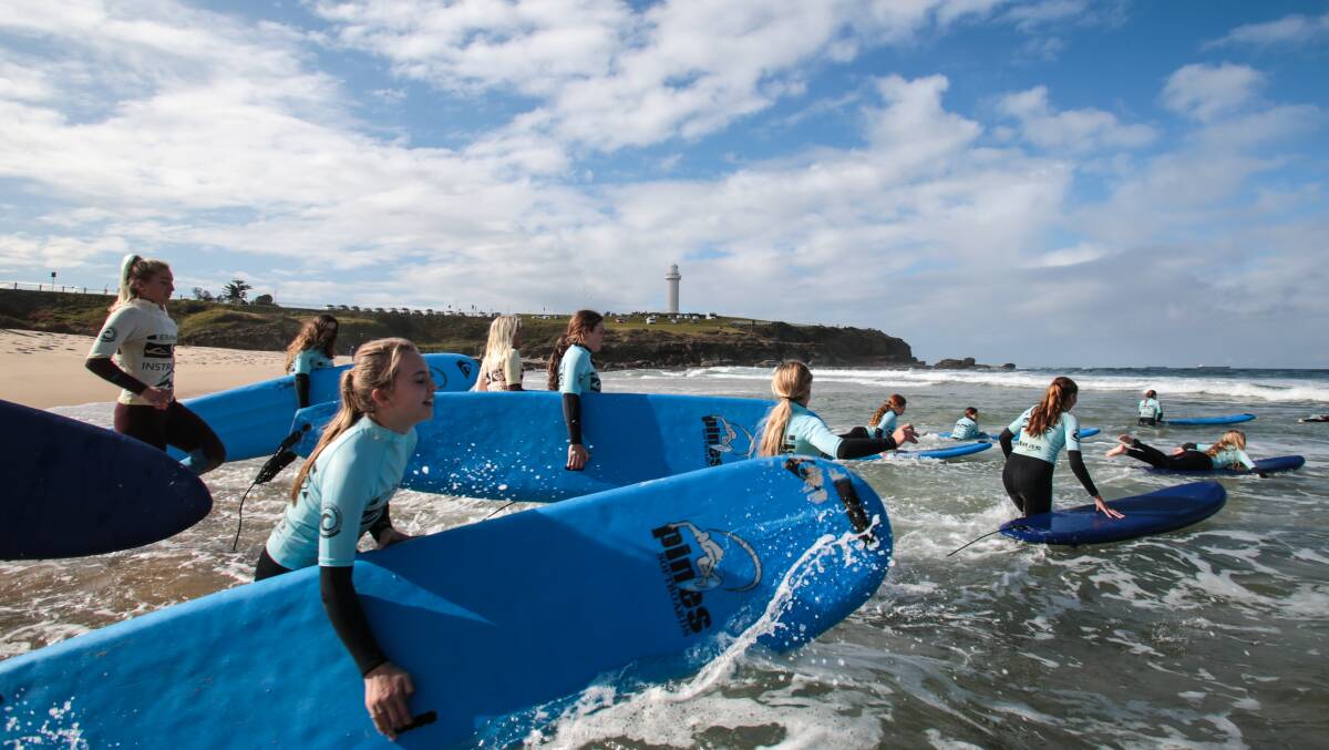 Girls from St Mary's take part in a surfing lesson at City Beach. Picture: ADAM McLEAN