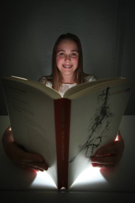 Bookworm: Cailey Thurlow is excited about Book Day. Picture: ADAM McLEAN