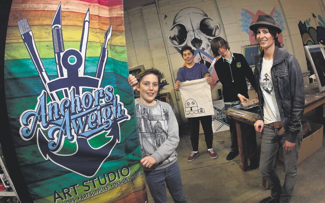 Julian Mayhew-Heijo, 12, Gabriel Mayhew-Heijo, 13, and Jasper Millican, 13, with Trina Collins at the Anchors Aweigh Studio which celebrates its first birthday this week. The studio teaches youngsters urban art techniques through workshops.Picture: ANDY ZAKELI