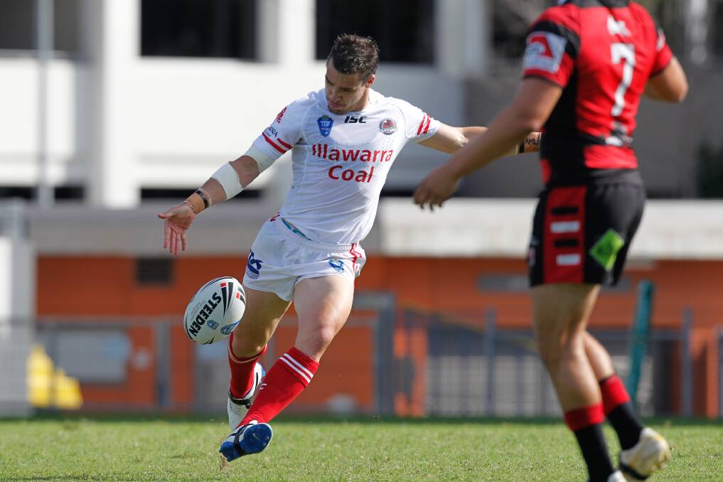 Illawarra Cutters' Michael Witt gets away a clearing kick against North Sydney. Picture: CHRISTOPHER CHAN