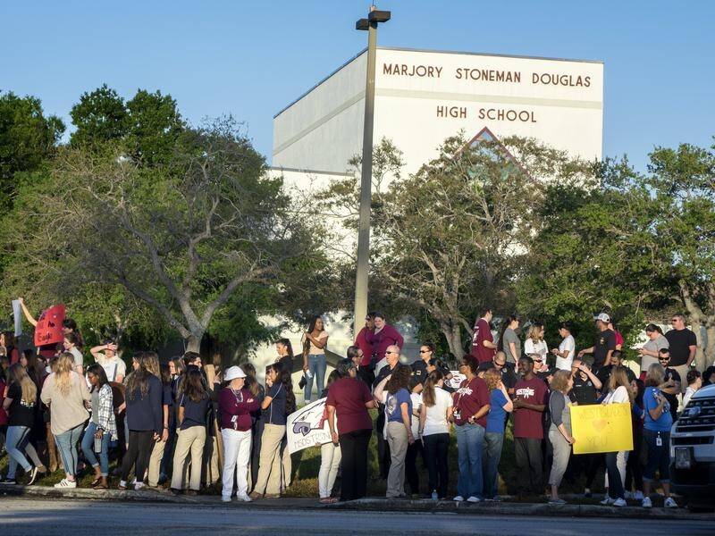 A Florida high school has reopened two weeks after 17 people were shot dead in a mass shooting.