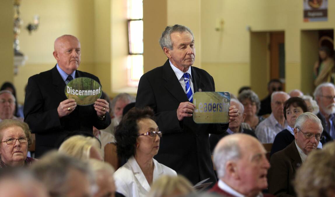 St Vincent de Paul president Dennis Walsh, right, at the commemoration in St Francis Xavier Cathedral. Picture: ANDY ZAKELI