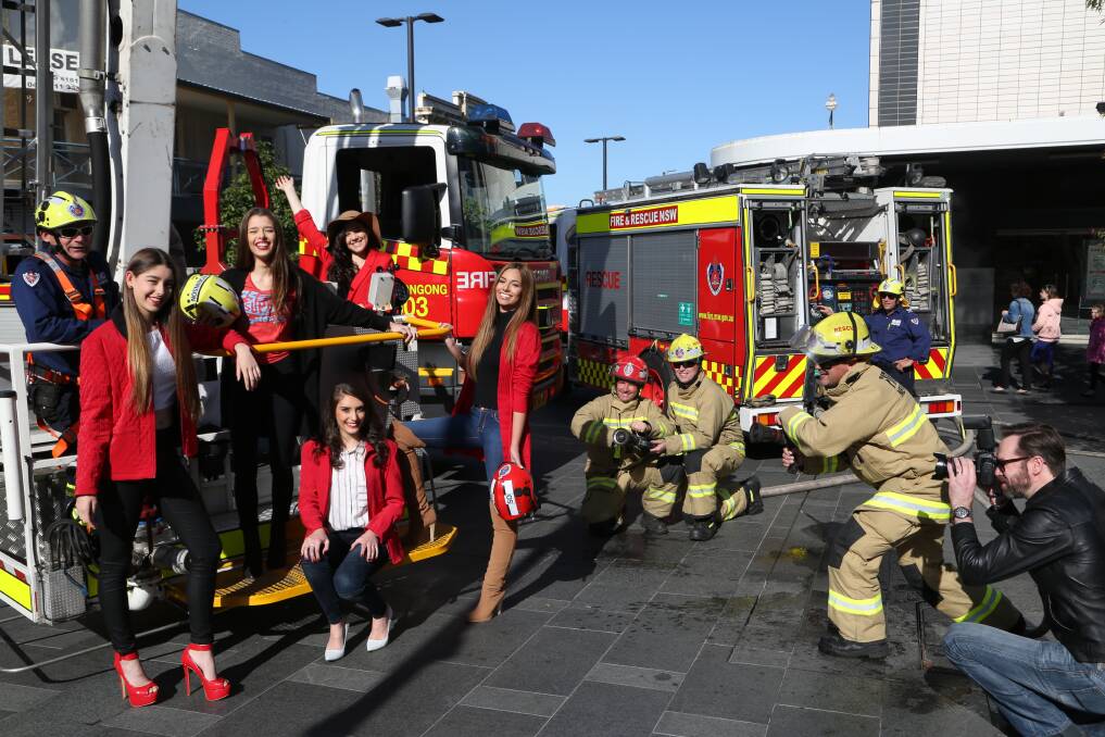 Illawarra Top Model entrants and photographer Alex Sturman turned up the heat on Wollongong firefighters (Fire & Rescue NSW) in their quest to win a modelling contract in Europe. Fashion by Black Pepper in Wollongong Central. Picture: GREG ELLIS
