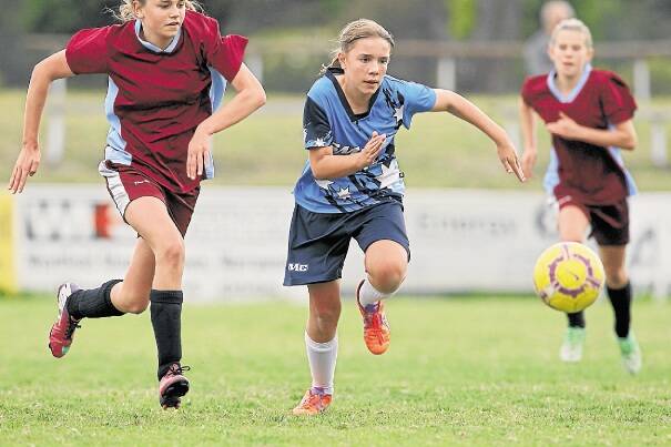 St Mary's soccer girls' Demi Goddard taking on Vincentia High in the Bill Turner Trophy at JJ Kelly Park. Photo: Christopher Chan
