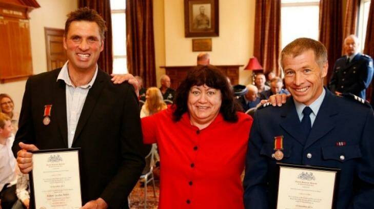 Robert Borst, left, and Peter Muldrew received bravery awards for saving Rhoda Davidson's life (centre). Photo: Mytchall Bransgrove
