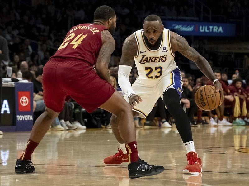 LeBron James fired for the LA Lakers against his former team Cleveland. (AP PHOTO)