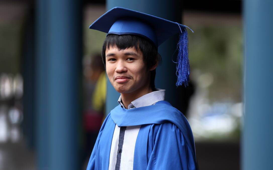 Double happy: Michael Nguyen after graduating in both software engineering and mobile computing.Picture: ROBERT PEET