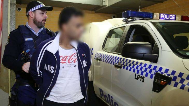 Arrested: One of four men arrested for allegedly buying bank customers credit card details from a call centre worker. Photo: NSW Police