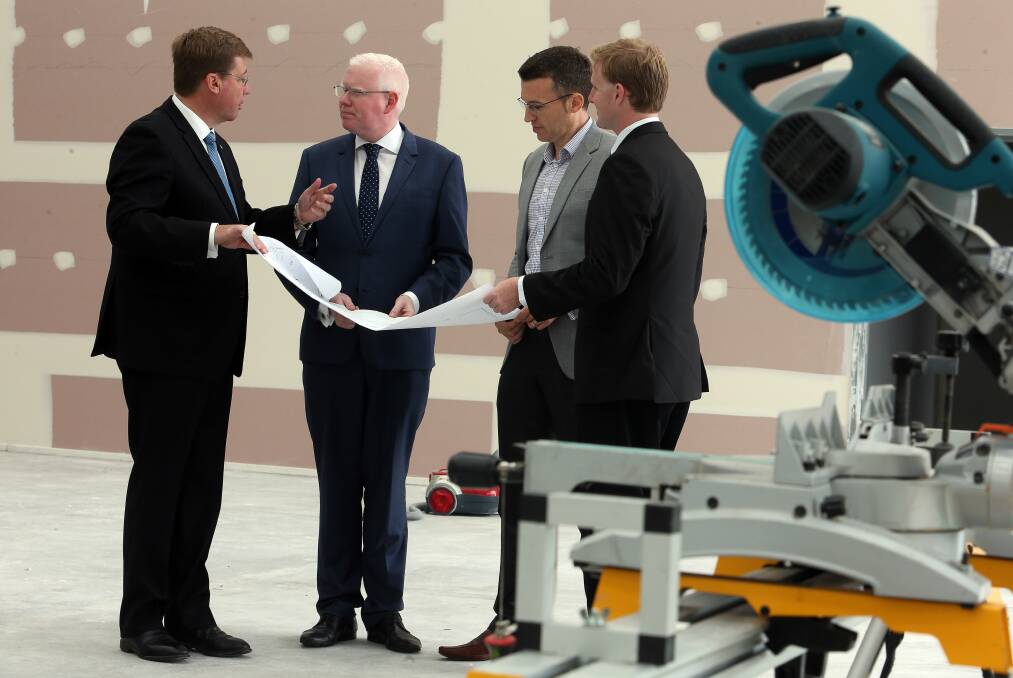 Timing: NSW Deputy Premier Troy Grant, left, Kiama MP Gareth Ward, AquaHydrex general manager Paul Barrett and Liberal Wollongong candidate Cameron Walters discuss the funding deal.Picture: ROBERT PEET