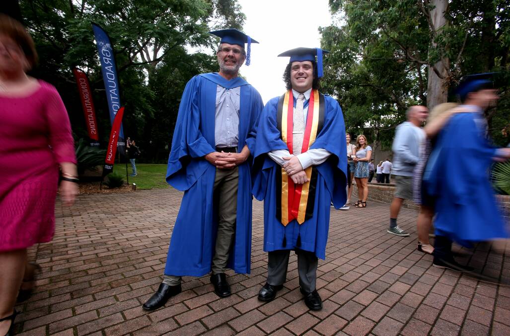 Indigenous medical students Benjamin Armstrong and Stephen Henry at their graduation at the University of Wollongong.Picture: ROBERT PEET