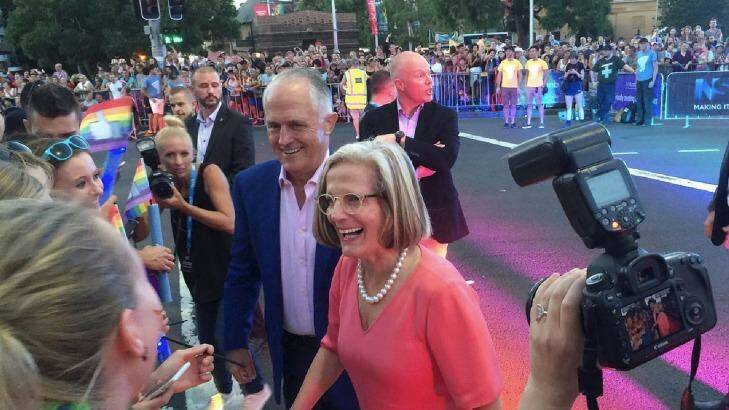 Prime Minister Malcolm Turnbull and his wife, Lucy, greet revellers on Oxford Street during Mardi Gras.