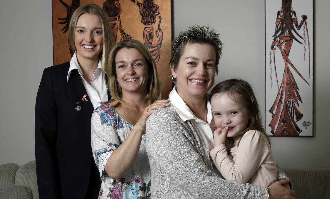 Battle: Twins Melissa Fahey, second left, of Darkes Forest, and Mandi Holman, second right, of Helensburgh, share a gene mutation that causes breast cancer. With them is Melissa's daughter Sarah, left, and Mandi's daughter Penny.Picture: ANDY ZAKELI