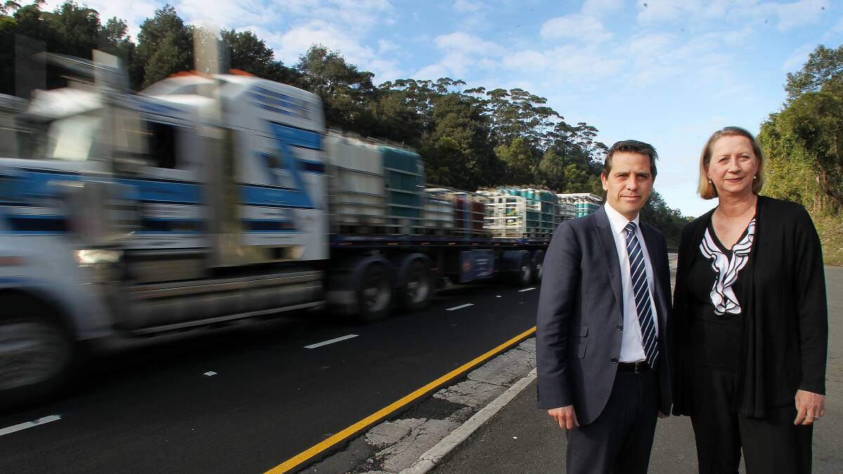 Still waiting: Ryan Park and Sharon Bird discuss delays at the Mount Ousley truck stop. Picture: GREG TOTMAN