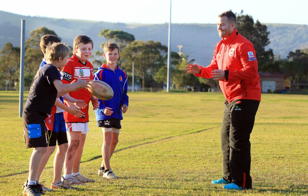 Trent Merrin training with Gerringong juniors (from left) Declan West, Darcy Thompson, Tyler Brown and Braxton Doherty. Picture: SYLVIA LIBER