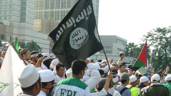 Members of  FPI, the Islam Defenders Front, take to the streets in Jakarta. Photo: Michael Bachelard