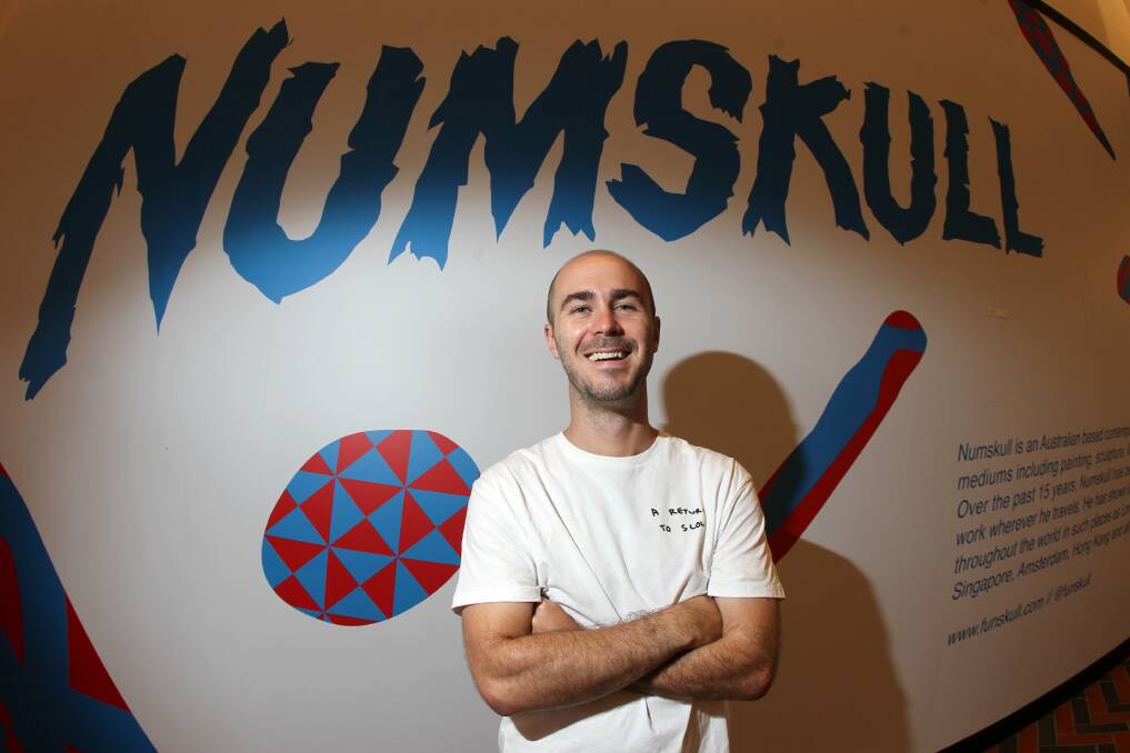 Street artist Numskull prepares to paint a mural inside Wollongong Central. Picture: GREG TOTMAN