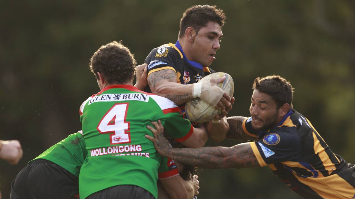 Jamberoo and Jets players tussle for the ball in tight encounter with the Roos running out winners. Picture: CHRISTOPHER CHAN