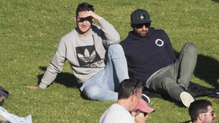 Back home: Former teammates Tim Moltzen and Benji Marshall watch from the hill. Photo: Dominic Lorrimer